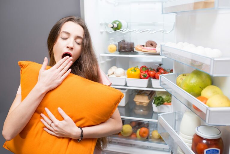 woman tired at fridge