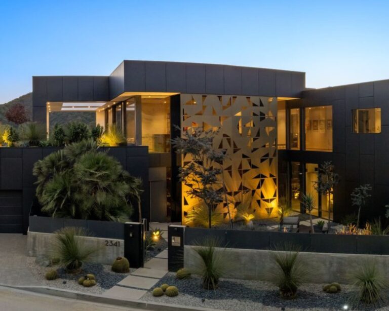 The dark exterior and gold geometric shapes of the facade. Image Compass