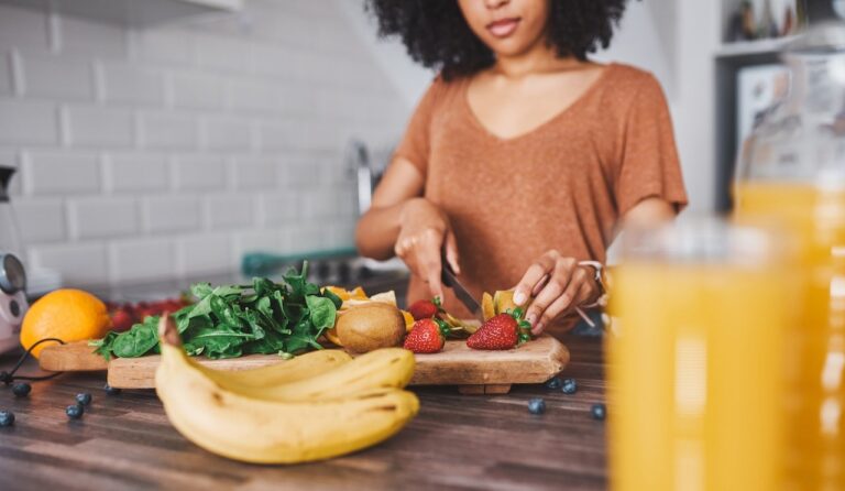 woman cutting fruit