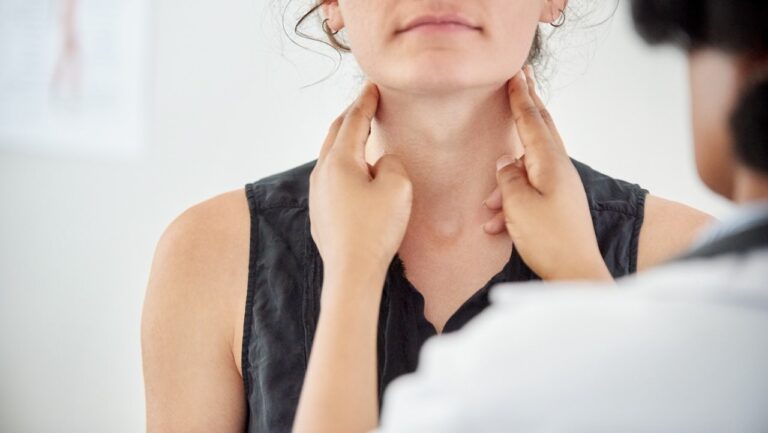 doctor examining womens throat