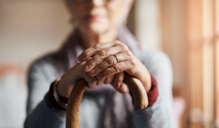 woman holding cane